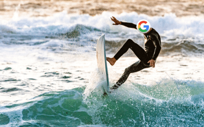 surfer riding waves with Google logo