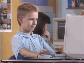 Gif of 90s kid giving thumbs up at a computer