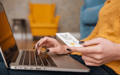 Closeup of online shopper's hands holding credit card