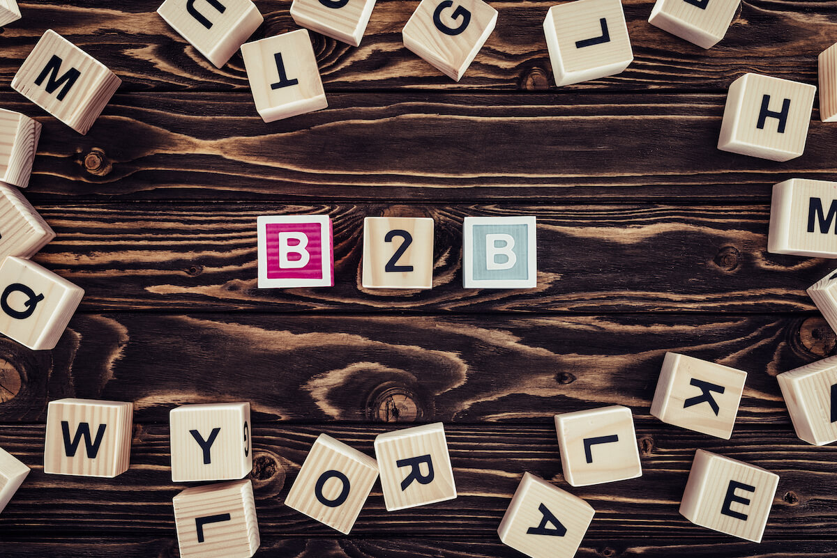 Lettered blocks scattered with the ones in the middle spelling out "B2B".