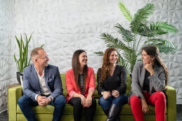 A group of people sitting on a couch
