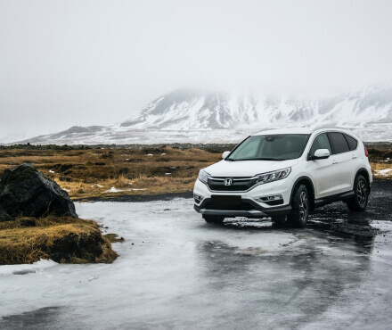 A car parked in a snowy area
