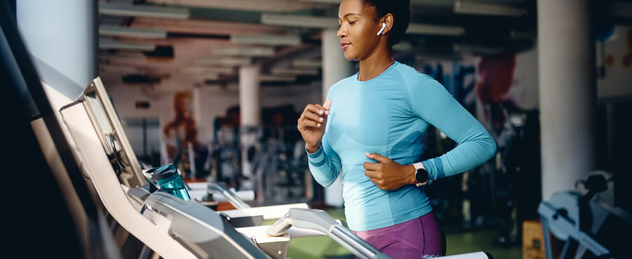 A woman running on treadmill
