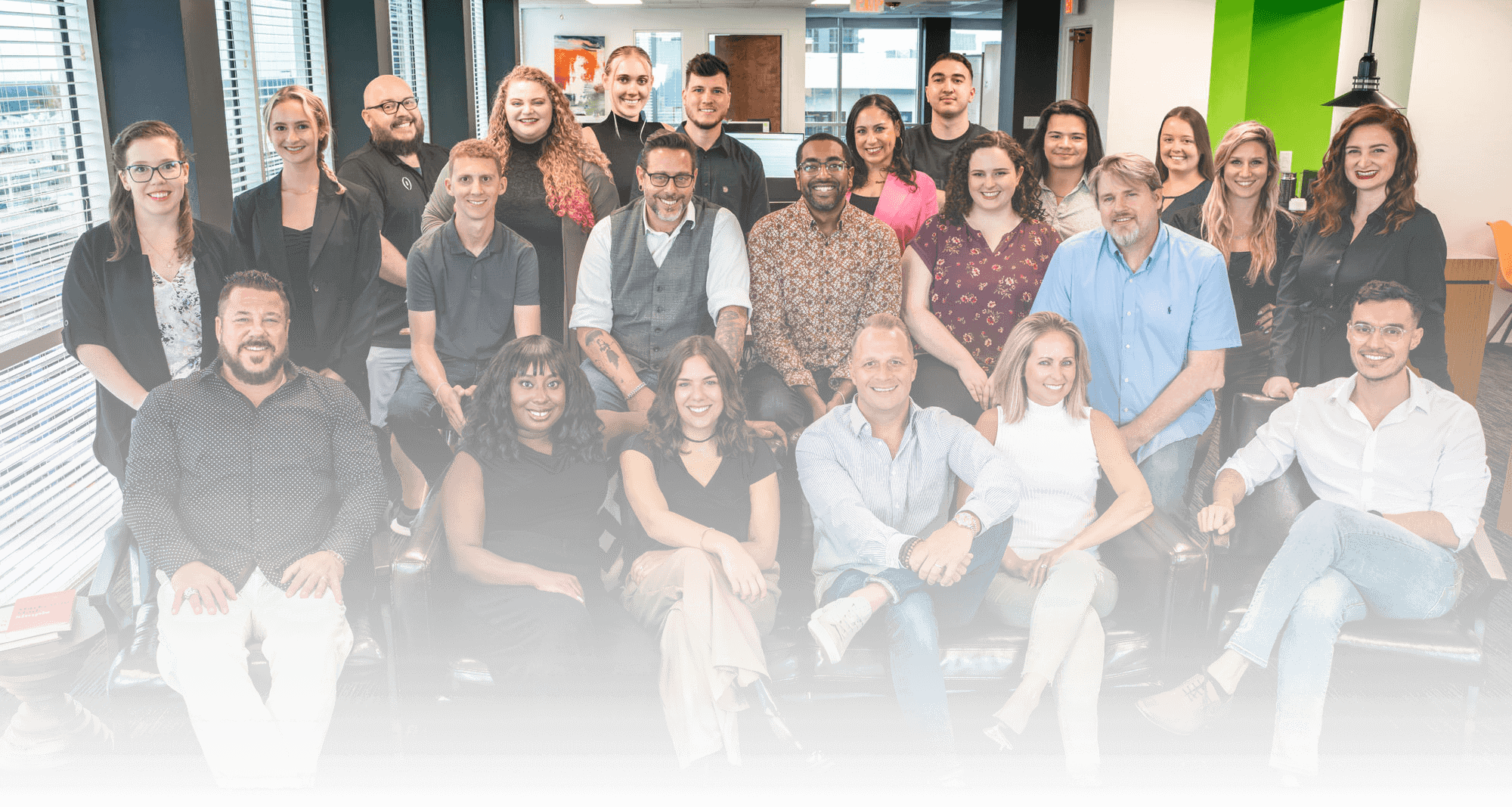 A group of employees smiling for a picture